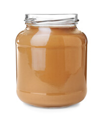 Delicious peanut butter in glass jar isolated on white