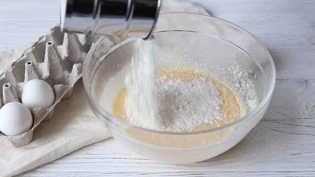 Batter preparation process, adding flour to beaten eggs