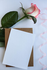 Fototapeta premium postcard mockup. bouquet of pink roses and place for text 