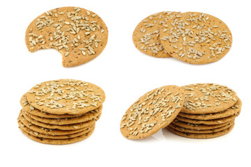 Crispy spelt crackers and some stacked  with sunflower seeds on a white background