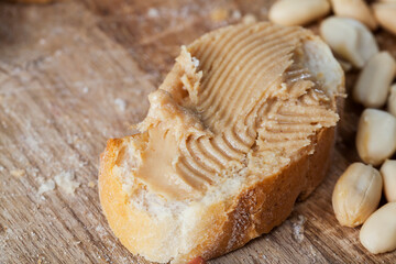 ingredients for preparing a quick Breakfast of bread and peanuts