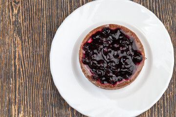 fruit tartlet with milk cheese filling and lots of blueberries