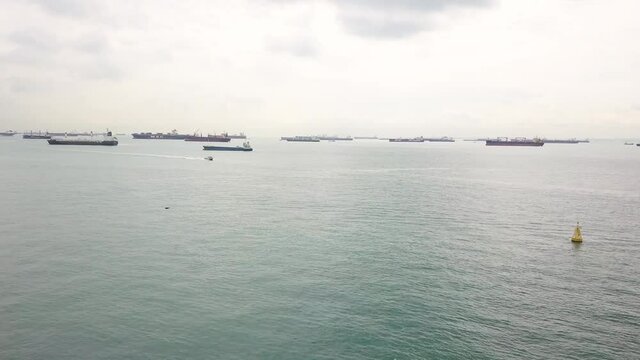 Drone shot of boats moving in Singapore anchorage