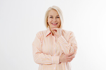 Happy beautiful close up portrait middle age blonde woman. Mid aged healthy female isolated on white background with copy space. Menopause and healthcare. Mature lady wrinkled face. Folded hands