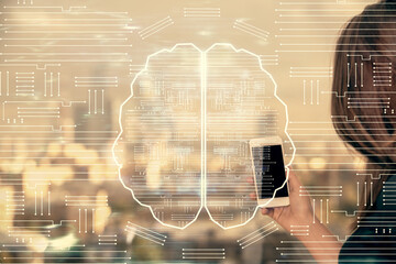 Double exposure of brain sketch hologram and woman holding and using a mobile device.