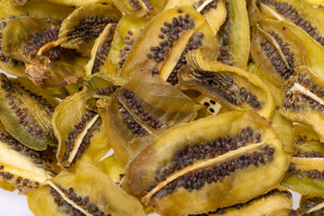 Fototapeta premium Dried kiwi fruit slices. Perfect as a snack, addition to ice cream and other desserts.