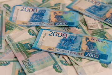 Obraz na płótnie Canvas Money Russian banknotes in denominations of two thousand and one thousand rubles.Money background.