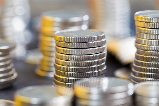 coins of silver color stacked together