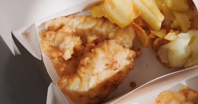 Top view of traditional Greek fried cod fish in card boxes for delivery, mediterranean cuisine, Greece March 25 food tradition. 