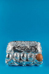 Eggs in aluminum foil.