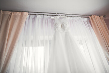 The perfect wedding dress in the room of the bride