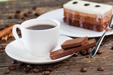 coffee with chocolate and multi-layer cake for dessert,