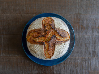 Home-made sourdough bread baked after a long cold- fermentation with organic wheat flour and rye flour.