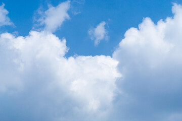 Beautiful view of blue sky with clouds. Beautiful shapes, partly cloudy. Colorful sunset. Natural sky background texture, beautiful color. Bright landscape in the blue sky.
