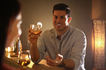 Man and woman flirting with each other in bar