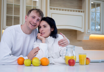 Obraz na płótnie Canvas Happy young couple in kitchen. Couple in love. Sensual. Man and woman. Happy day. 