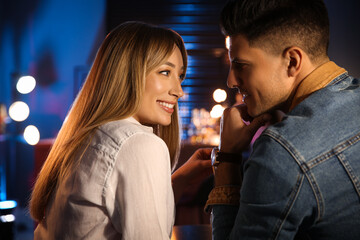 Man and woman flirting with each other in bar