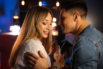 Man and woman flirting with each other in bar