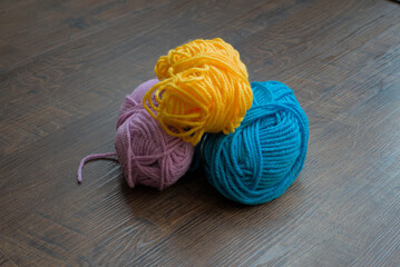 pink, yellow and blue wool balls