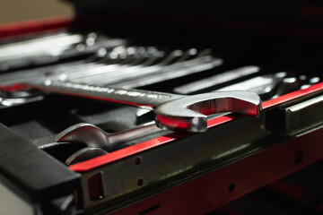 Close-up of a wrench on a drawer of a toolbox
