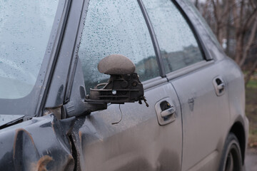 broken left car mirror after traffic accident