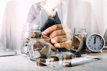 Healthcare costs and fees concept.Hand of smart doctor used a calculator for medical costs in modern hospital