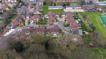 Aerial photo of a typical residential housing estate in the UK, taken in the village of Alverthorpe in Wakefield West Yorkshire showing a modern cul-de-sac residential housing estate in the spring