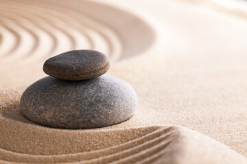 Obraz na płótnie Canvas Japanese zen garden with stone in raked sand