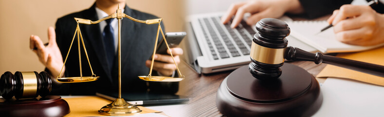 Business and lawyers discussing contract papers with brass scale on desk in office. Law, legal...