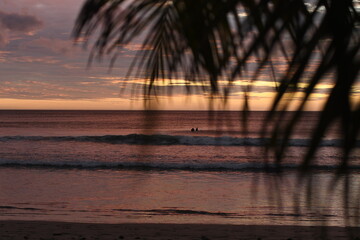 Sunset on the beach with surfers Nicaragua