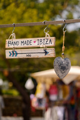 Wooden plaque with the inscription Hand Made Ibiza..Hippie market.