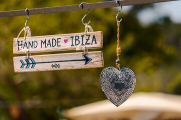 Hippie decor. Wooden plaque with the inscription Hand Made Ibiza