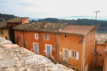 Fototapeta na wymiar Old houses painted with ocher. Roussillon tourist village. Provence. France.