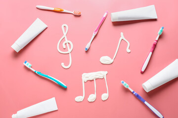 Drawn music notes and tooth brushes with paste on color background