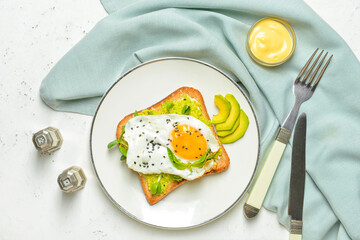 Plate with tasty sandwich on white background