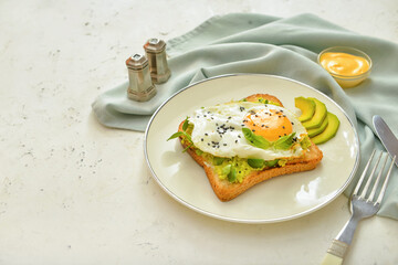 Plate with tasty sandwich on white background