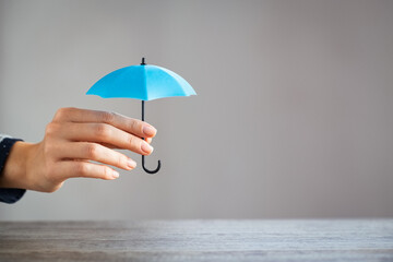 Protection concept while holding small umbrella