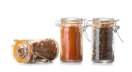 Jars with different spices on white background
