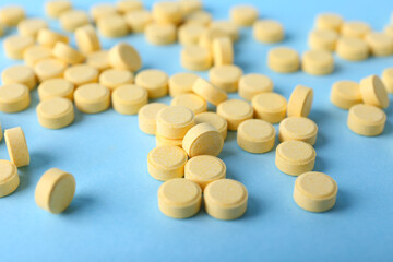 Folic acid pills on color background
