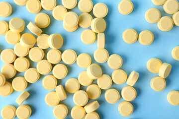 Folic acid pills on color background