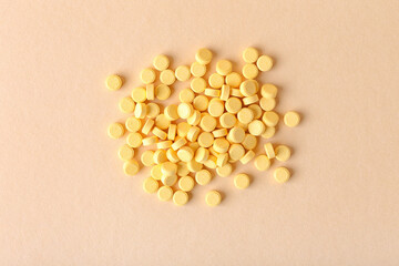Folic acid pills on color background