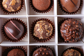 Box with sweet chocolate candies, closeup
