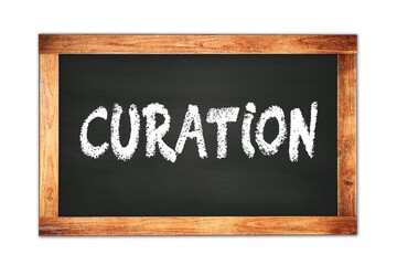 CURATION text written on wooden frame school blackboard.