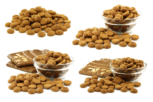 bunch of Dutch "pepernoten"  eaten at Dutch festivities around december 5th called "Sinterklaas" in a glass bowl with some pieces of speculaas on a white background