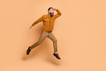 Full size profile portrait of astonished person hand on forehead look empty space isolated on beige color background