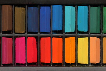 crayons on black background