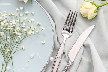 Beautiful table setting with flowers, top view