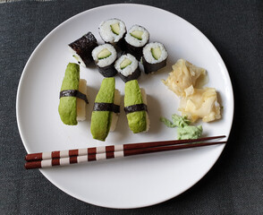 Vegetarian or vegan sushi with avocado, seaweed and cucumber