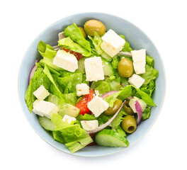 Bowl with fresh Greek salad on white background