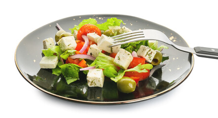 Plate with fresh Greek salad on white background